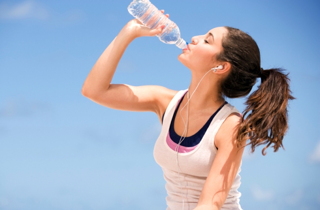 teenage girl drinking water